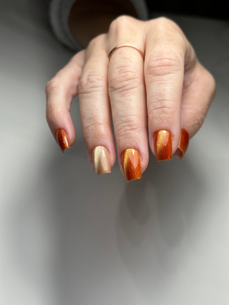 Orange cat eye gel polish Russian manicure 