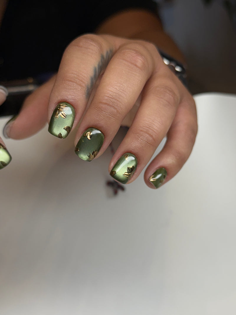 Green cat eye with gold nail design russian manicure