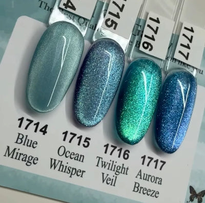A close-up of a nail set featuring ICEGEL Wind Star Galaxy Cat Eye Gel Polish in shade 1717 Aurora Breeze, showing the rich blue color and the shimmering magnetic line effect.