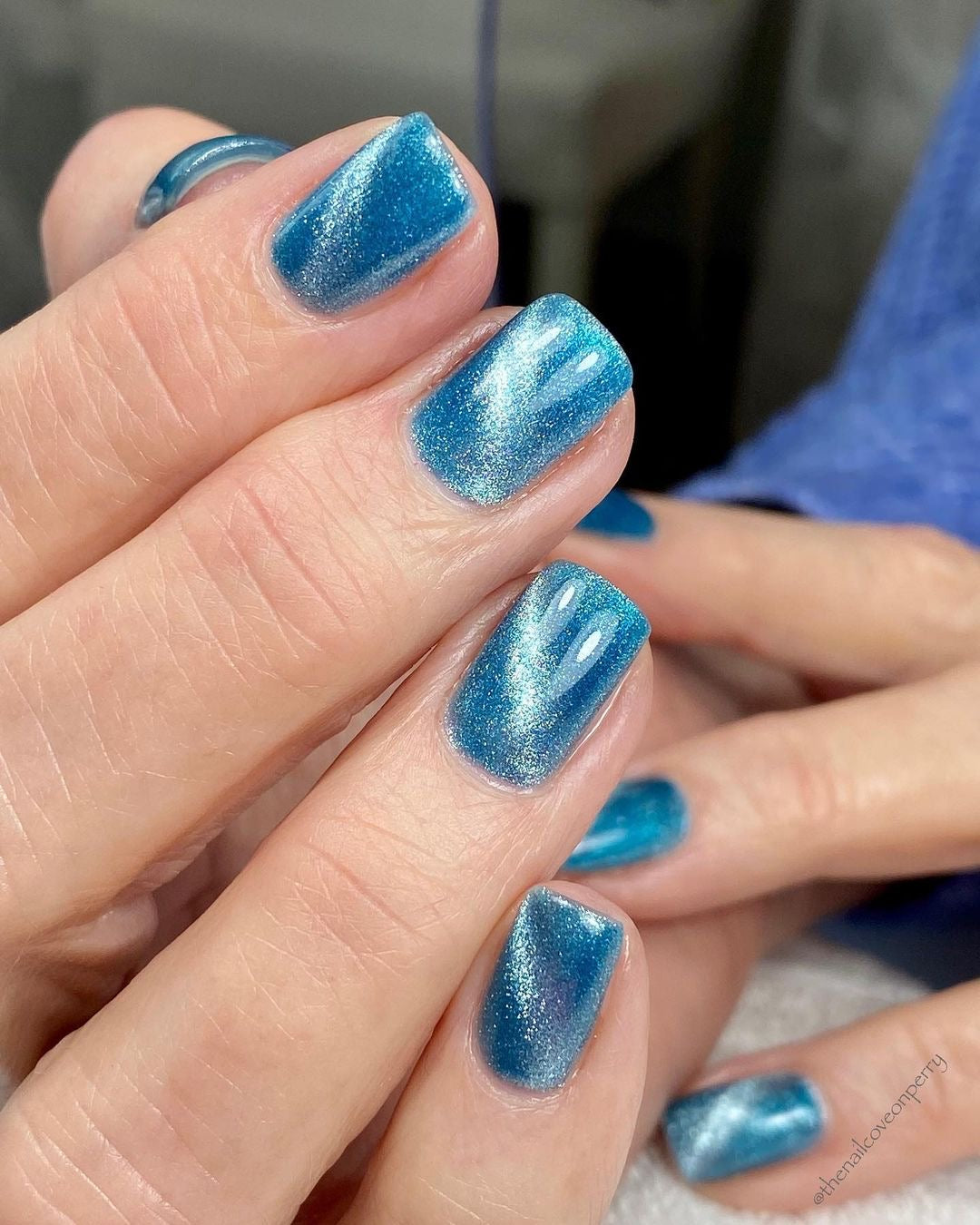 Russian manicure with blue cat eye gel polish