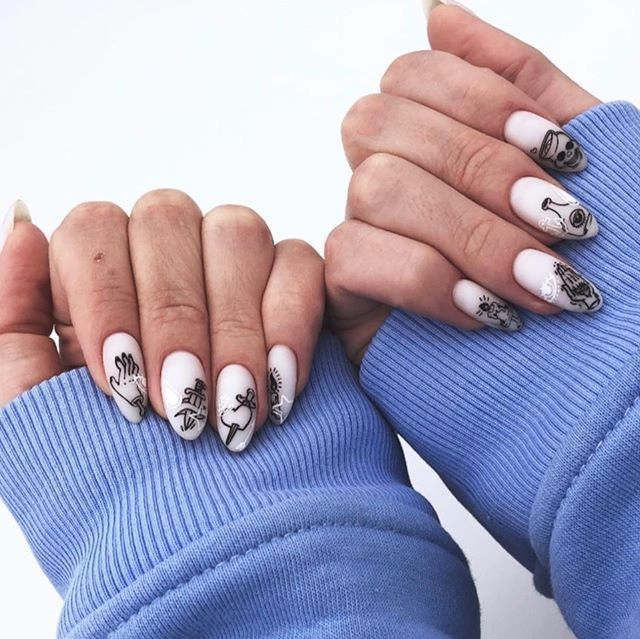 Manicure with hearts and swords from stamping plates