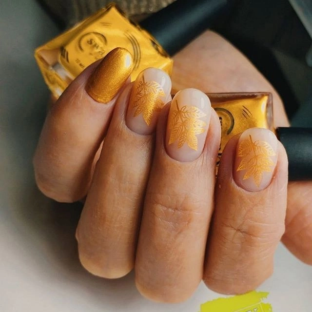 Nail art created with gold stamping polish