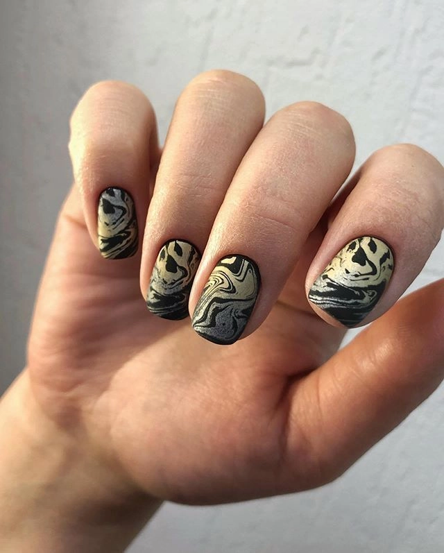 Abstract manicure created with stamping plates